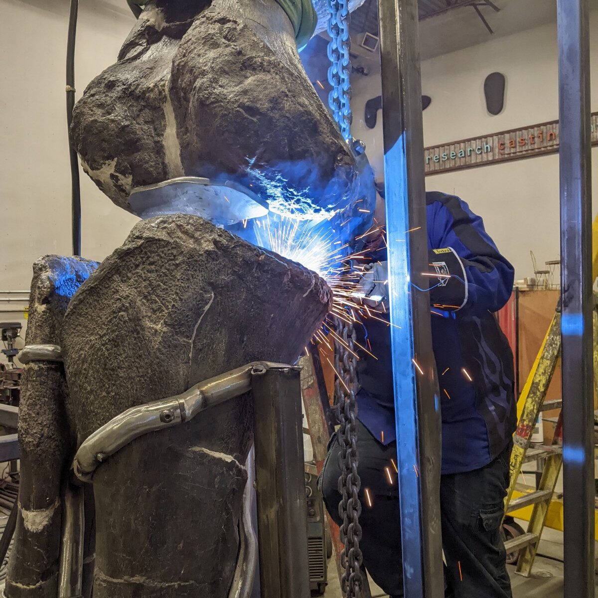 Welding a Brontosaurus enormous tibia and fibula